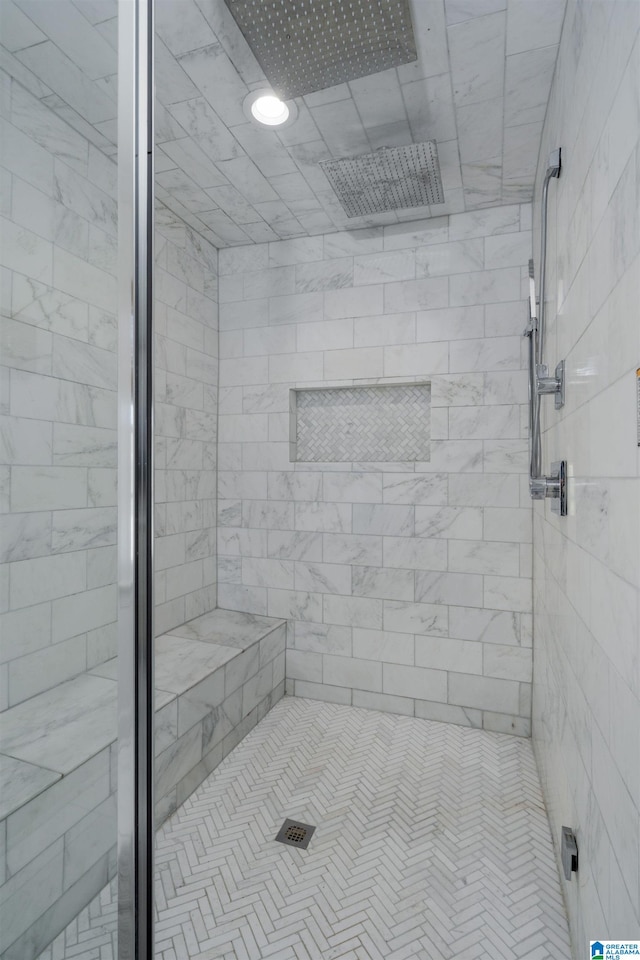 full bathroom with tiled shower