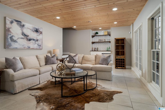 living area featuring light tile patterned floors, recessed lighting, and wooden ceiling