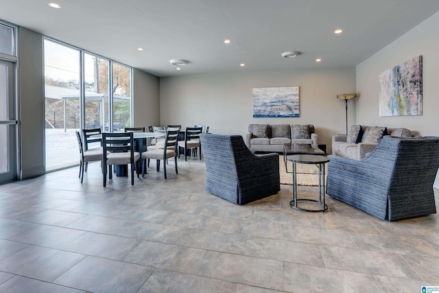 living area with recessed lighting and floor to ceiling windows