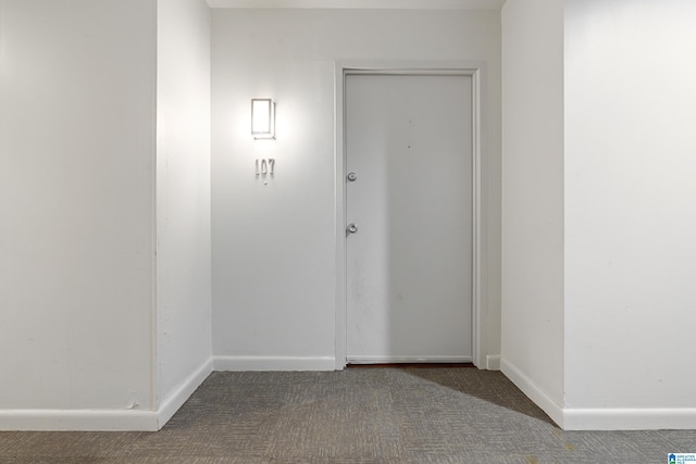 interior space with baseboards and carpet