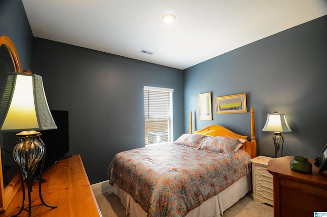 bedroom with carpet flooring and visible vents