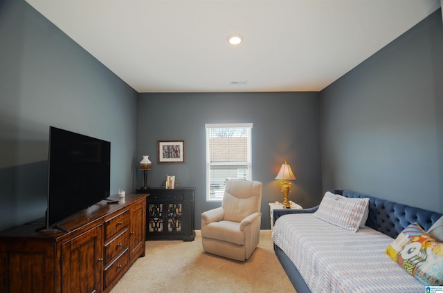 bedroom featuring light carpet and visible vents