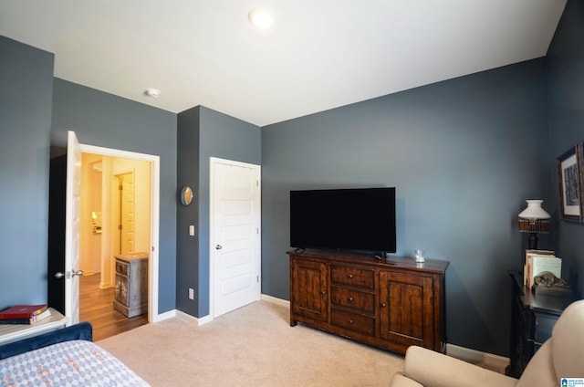 bedroom with carpet floors and baseboards