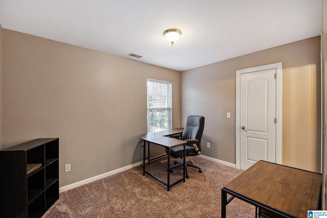 office featuring baseboards, visible vents, and carpet floors