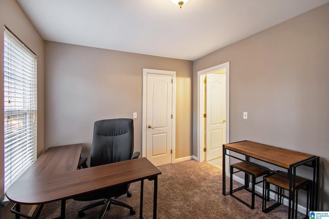 home office featuring baseboards and carpet floors