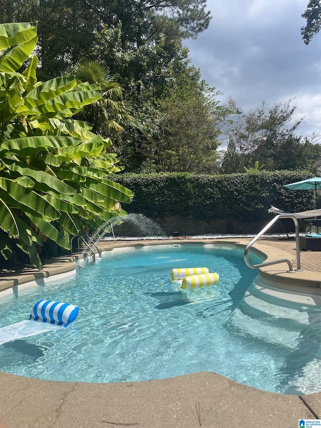 view of pool featuring a fenced in pool and fence