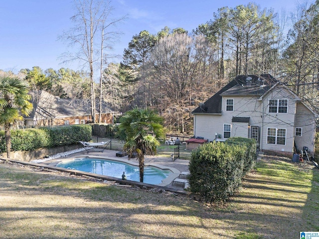 view of pool featuring a fenced in pool, a yard, a patio area, and fence