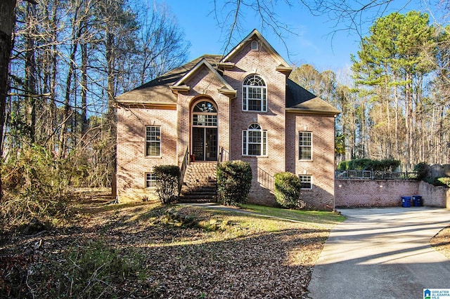 view of front of property with concrete driveway and brick siding