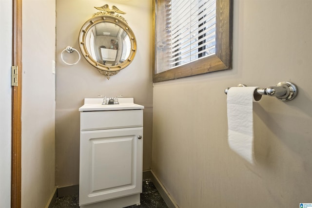 bathroom featuring baseboards and vanity