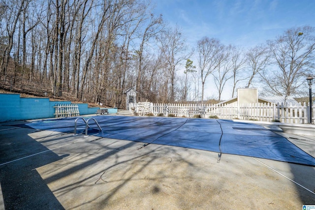 view of pool with fence