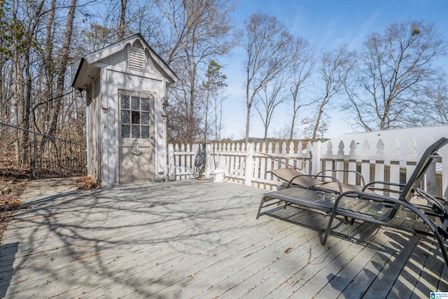 wooden deck with an outdoor structure