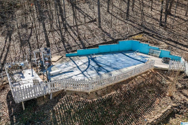 view of swimming pool featuring a deck