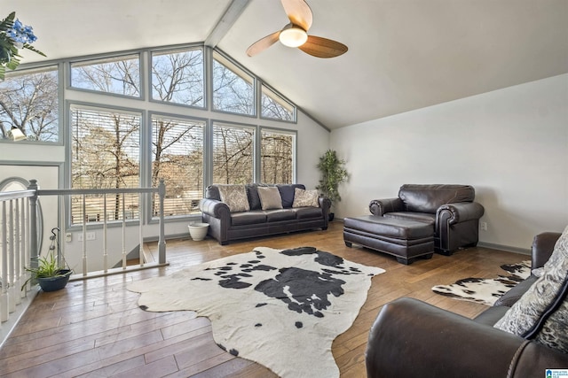 interior space featuring vaulted ceiling and a ceiling fan