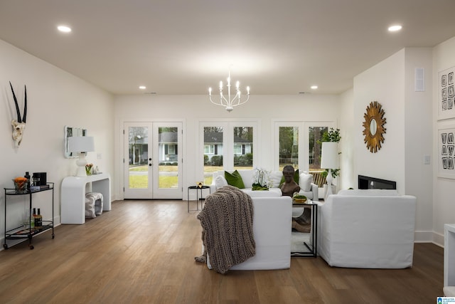 dining area with recessed lighting, a healthy amount of sunlight, french doors, and wood finished floors