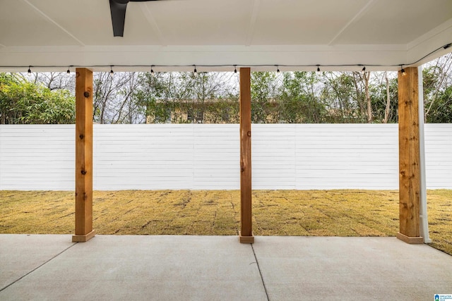 exterior space with a patio area, a fenced backyard, and a ceiling fan