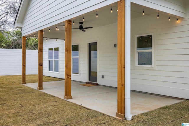 view of patio featuring a ceiling fan and fence