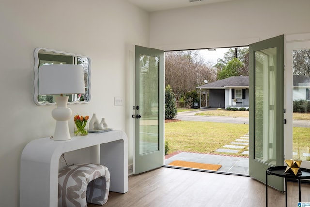 entryway with wood finished floors