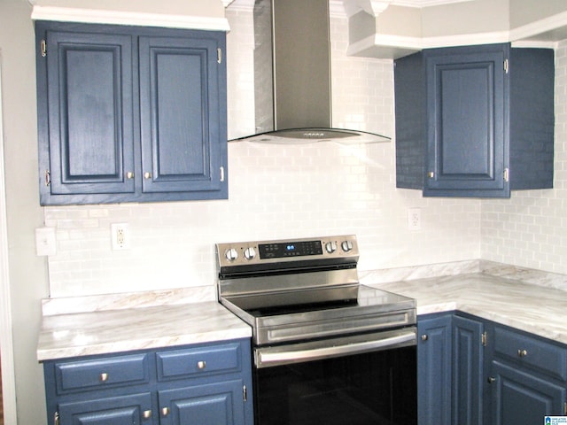 kitchen with wall chimney range hood, blue cabinets, stainless steel electric stove, and decorative backsplash