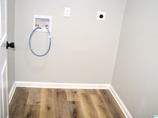 clothes washing area with laundry area, hookup for an electric dryer, hookup for a washing machine, and wood finished floors