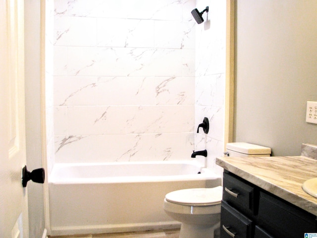 bathroom with toilet, tub / shower combination, and vanity
