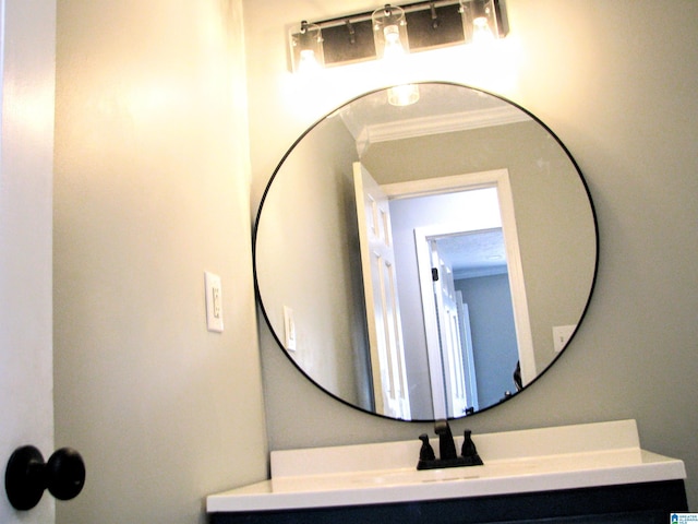 bathroom featuring vanity and ornamental molding