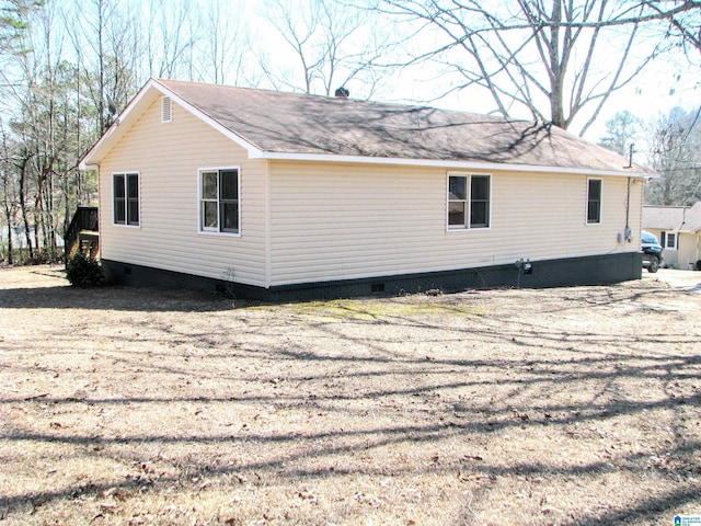view of side of property featuring crawl space