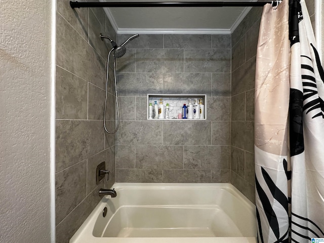 bathroom featuring ornamental molding, shower / tub combo, and a textured wall