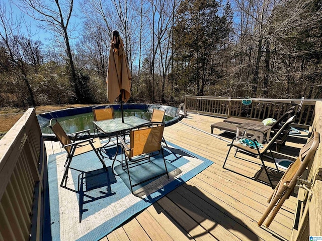 deck with outdoor dining space