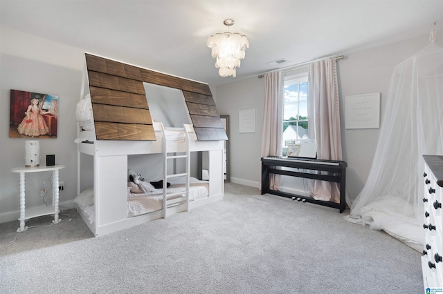 bedroom featuring visible vents, baseboards, carpet, and a chandelier