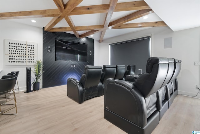 home theater with light wood finished floors, beamed ceiling, coffered ceiling, and baseboards