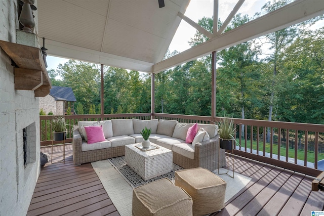 wooden deck with an outdoor living space