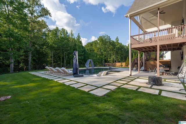 view of yard with a patio, stairway, fence, and a wooden deck