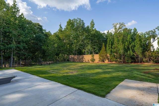 view of yard with a patio and fence