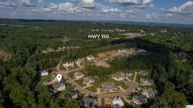 aerial view featuring a wooded view