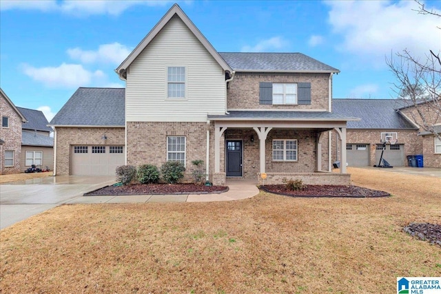 traditional-style home featuring a garage, driveway, brick siding, roof with shingles, and a front yard