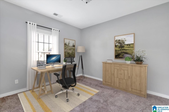 office featuring light colored carpet and baseboards