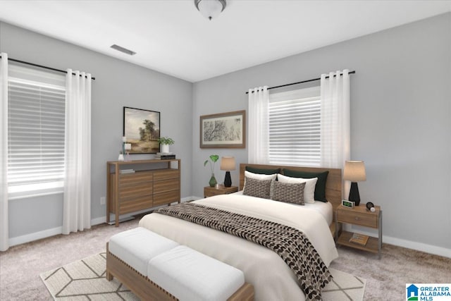 bedroom with carpet floors, visible vents, and baseboards