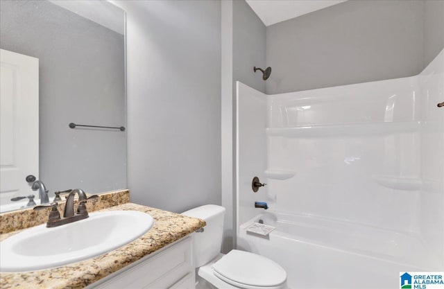 full bath featuring toilet, shower / bathtub combination, and vanity