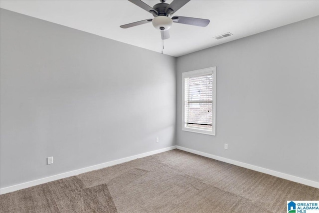 unfurnished room with a ceiling fan, baseboards, visible vents, and carpet flooring