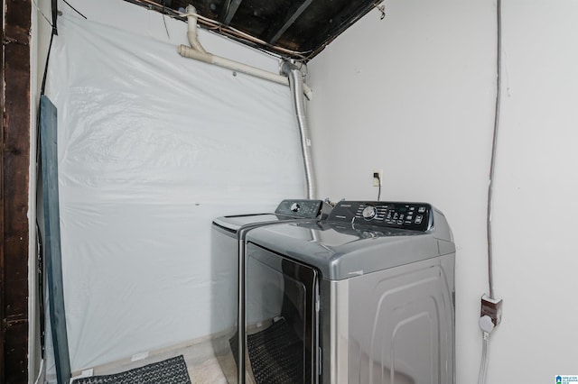 laundry room featuring washing machine and dryer