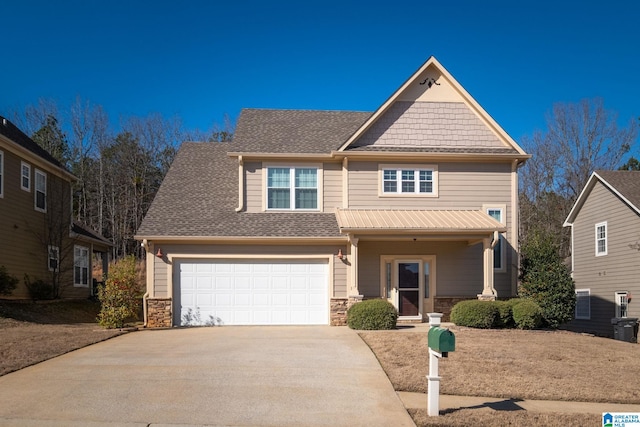 craftsman inspired home with concrete driveway, a garage, stone siding, and roof with shingles