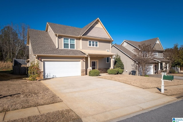 craftsman-style home featuring a garage, stone siding, driveway, and a shingled roof