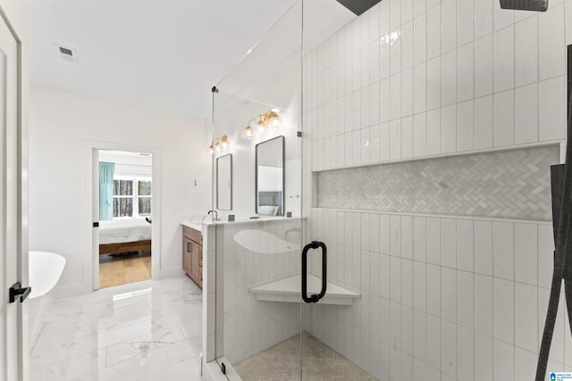 full bath featuring marble finish floor, visible vents, connected bathroom, a shower stall, and vanity