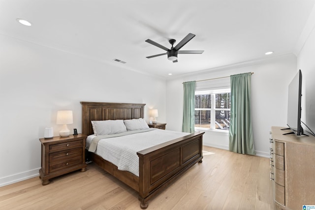 bedroom with recessed lighting, visible vents, baseboards, ornamental molding, and light wood-type flooring