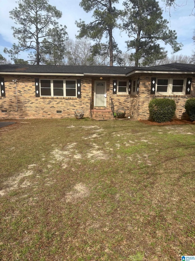 ranch-style home with brick siding and a front yard