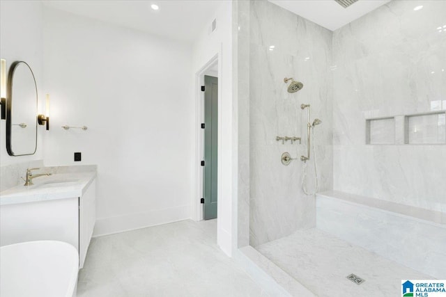 bathroom with a marble finish shower, visible vents, baseboards, a soaking tub, and vanity