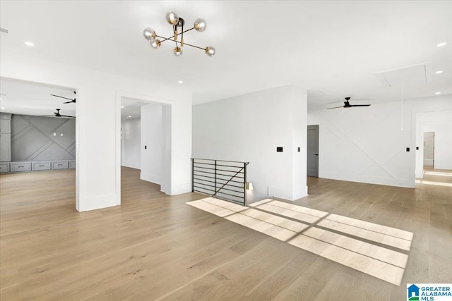 unfurnished room featuring wood finished floors, visible vents, attic access, recessed lighting, and ceiling fan