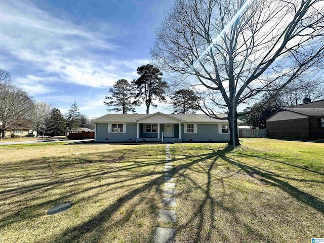 view of front of house featuring a porch, a front yard, and fence