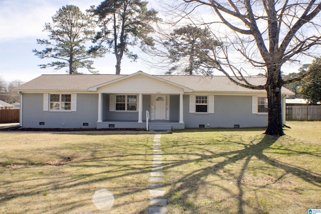 ranch-style home featuring brick siding, a shingled roof, fence, a front yard, and crawl space