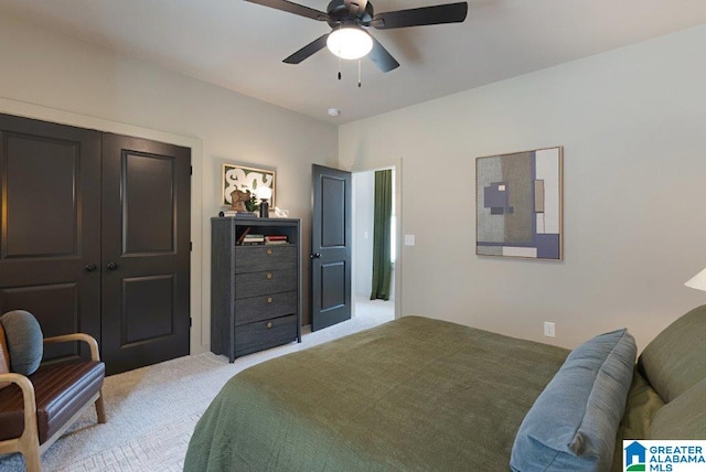 bedroom featuring a ceiling fan and light colored carpet